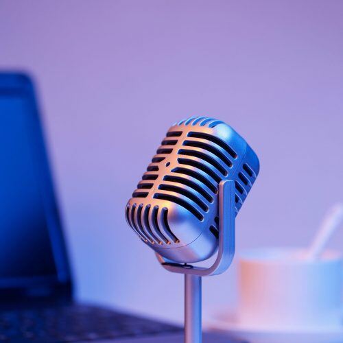 Retro microphone and notebook computer, live webcast on air concept